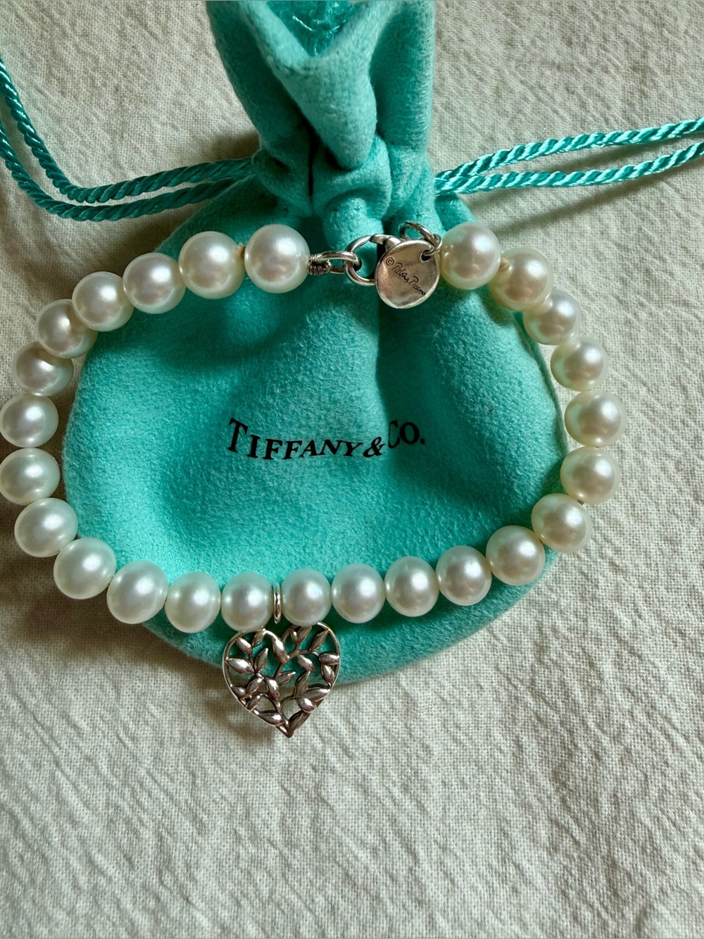 Tiffany & Co. White Pearl Bracelet with Silver Heart Charm on Blue Pouch
